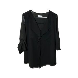 Calvin Klein sheer black blouse with long sleeves and ruffled neckline